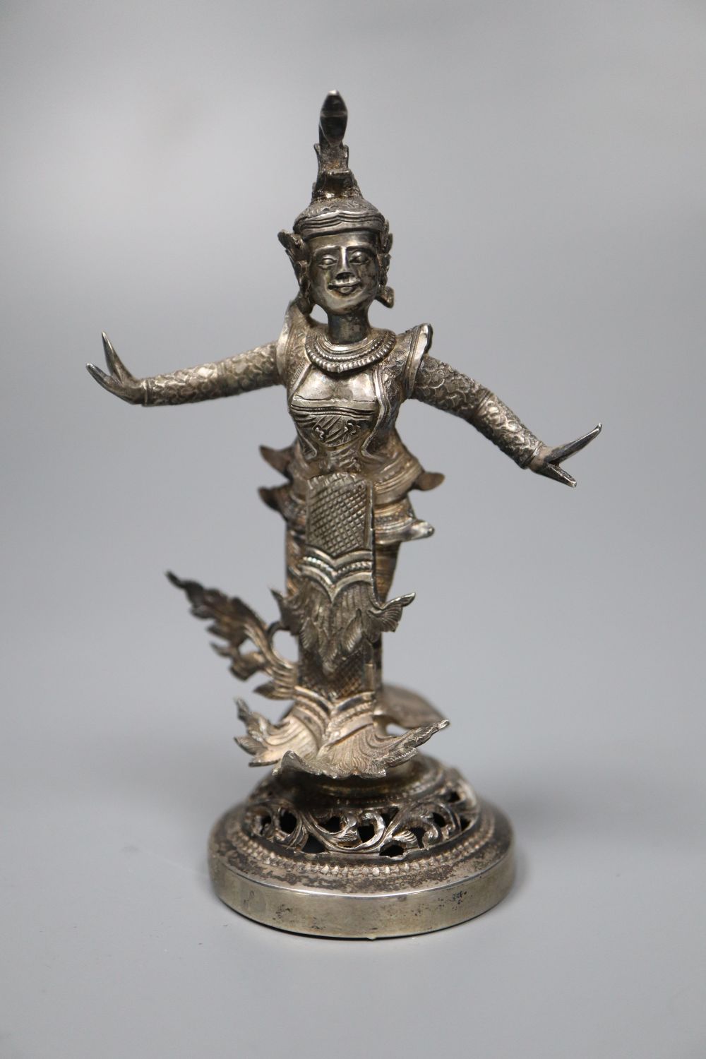A small Burmese white metal figural table decoration, 9cm, 88 grams.